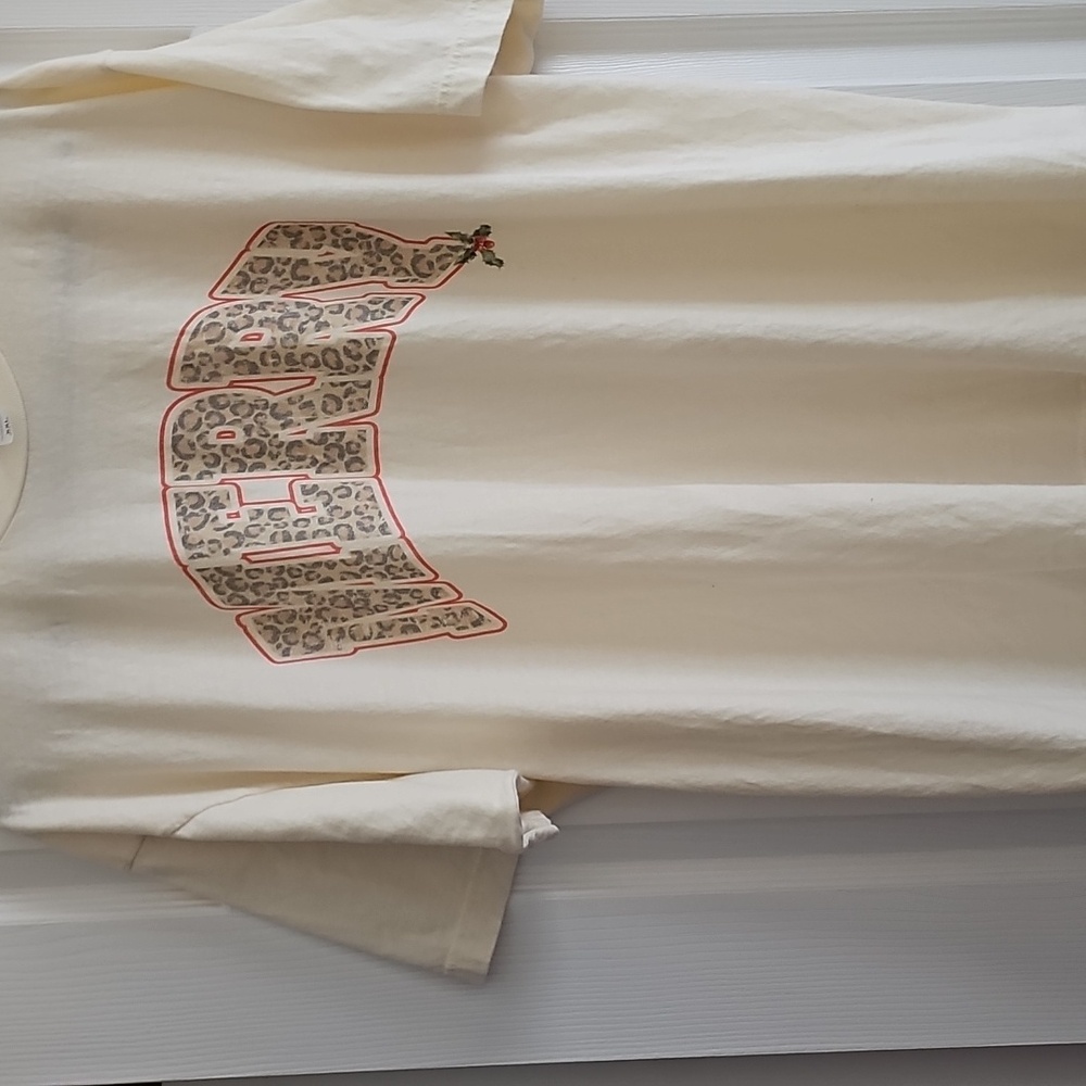 Christmas Holiday Cream Graphic T-Shirt with leopard print text